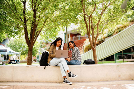 Female student outside happy