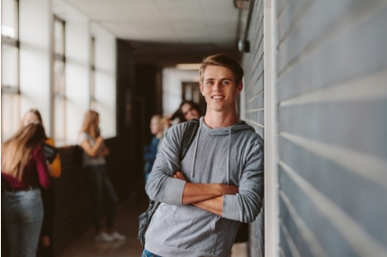 Male student standing inside