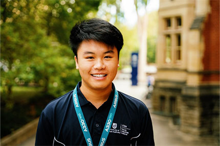 Student wearing beanie smiling